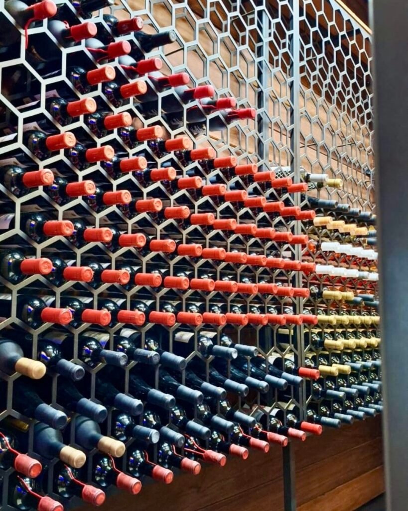 Bespoke wall-mounted wine rack handcrafted by Artifex