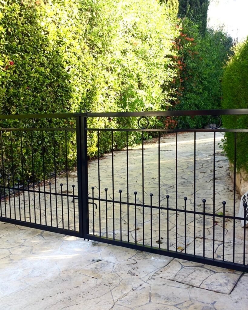 Black metal garden gate designed and made by Artifex