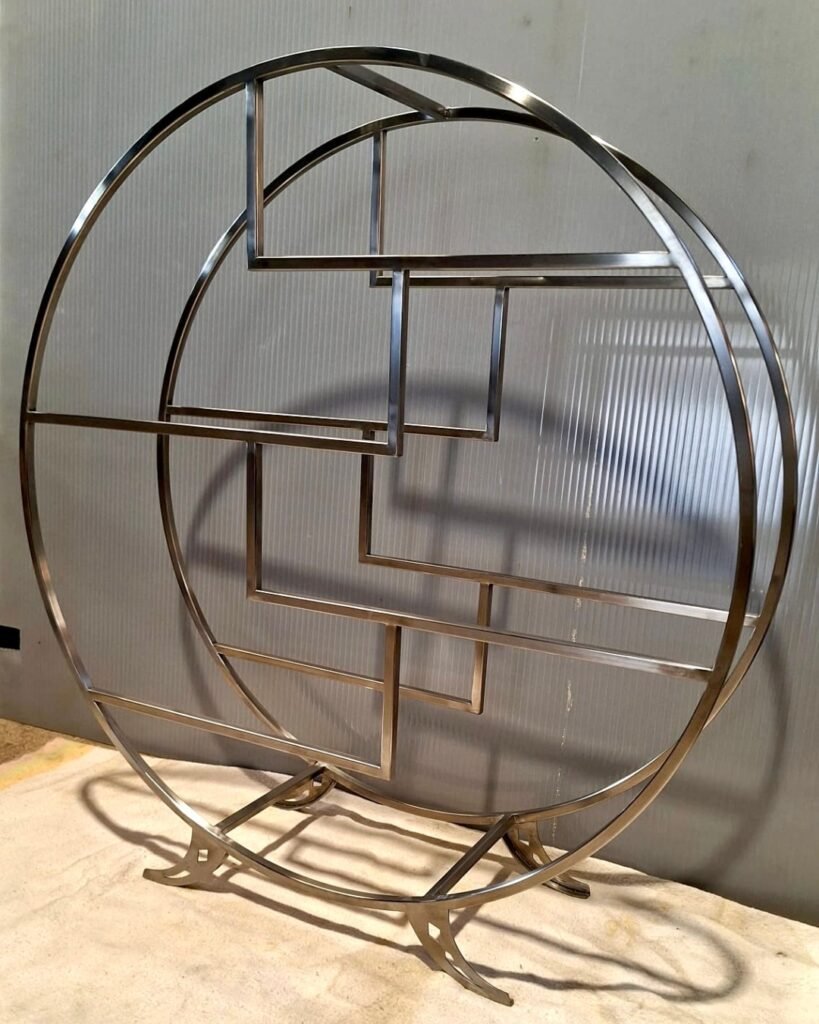 Circular black metal display shelf handcrafted by Artifex in Cyprus