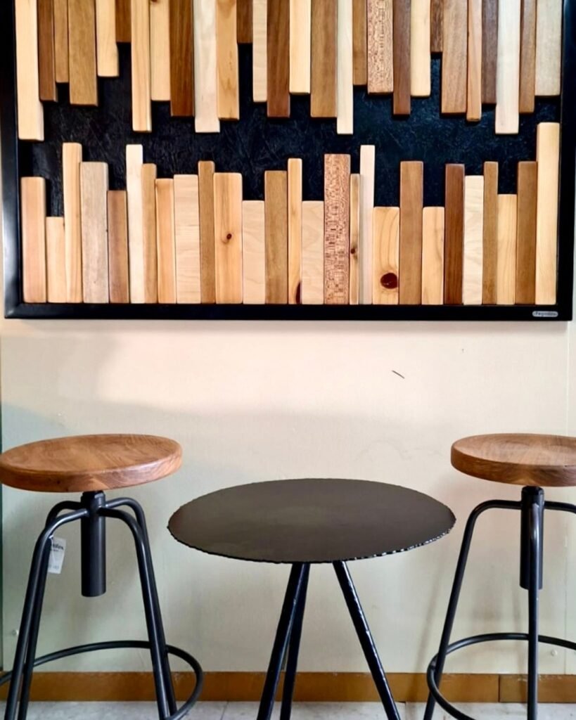 Custom wood and metal wall installation with stools by Artifex