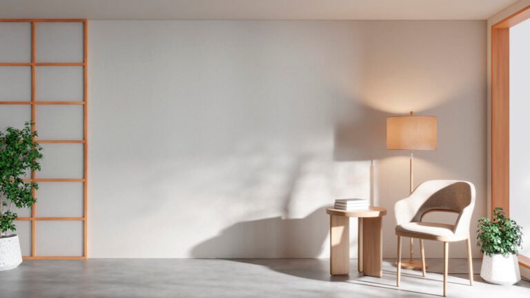 Light upholstered armchair and floor lamp in a minimalist room with soft sunlight.