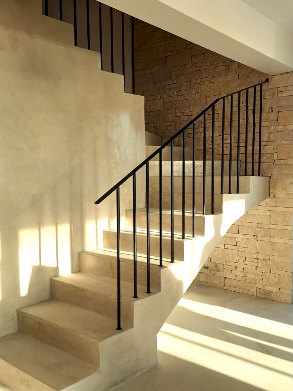 Custom black metal staircase railing by Artifex